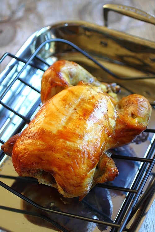 Homemade Chinese roasted whole chicken with orange golden glaze.