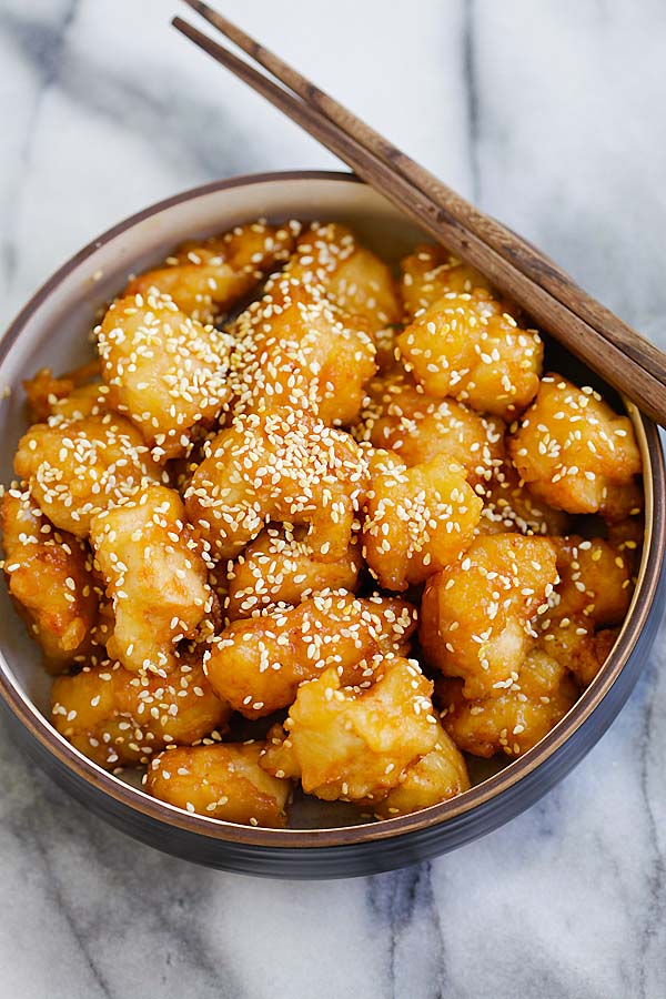 Delicious honey sesame chicken fried and coated in a sticky sweet and savory honey sesame sauce.