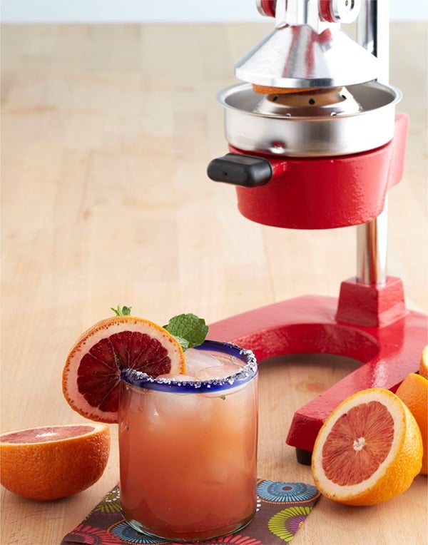 Easy homemade cocktail, Blood Orange Margarita with blood orange and silver tequila served in a glass.