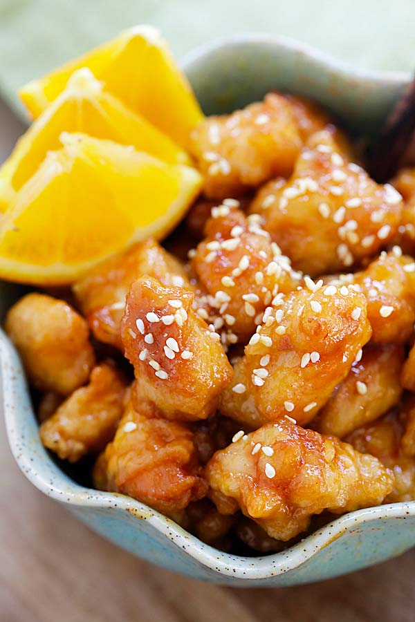Chinese orange chicken in a bowl. Delicious recipe that is better than takeout.