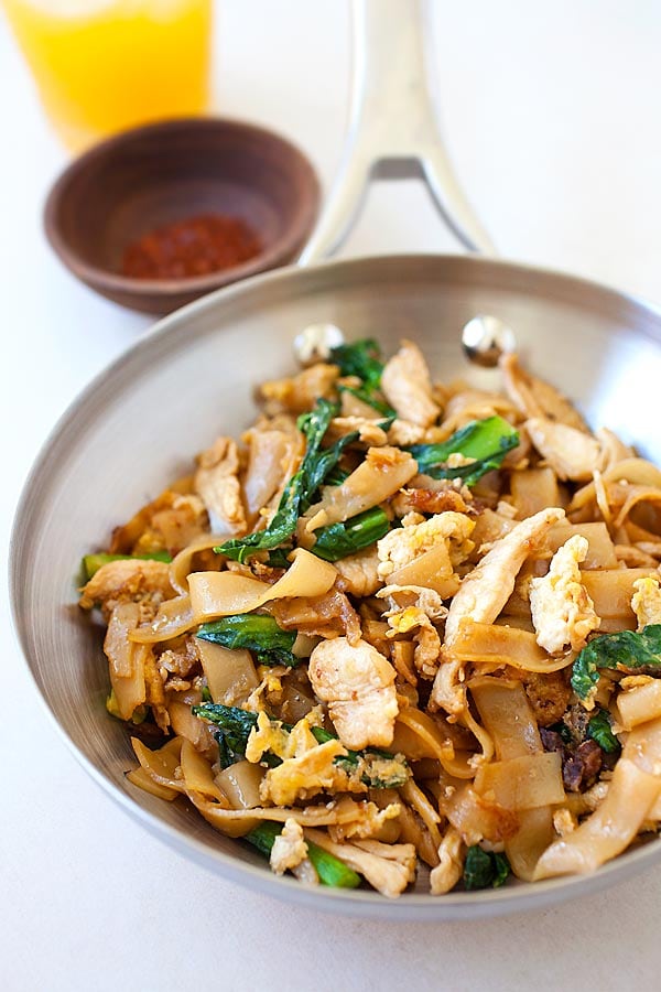 Delicious and easy chicken Pad See Ew or Pad Siew noodles in pad see ew sauce in a skillet, ready to be served.