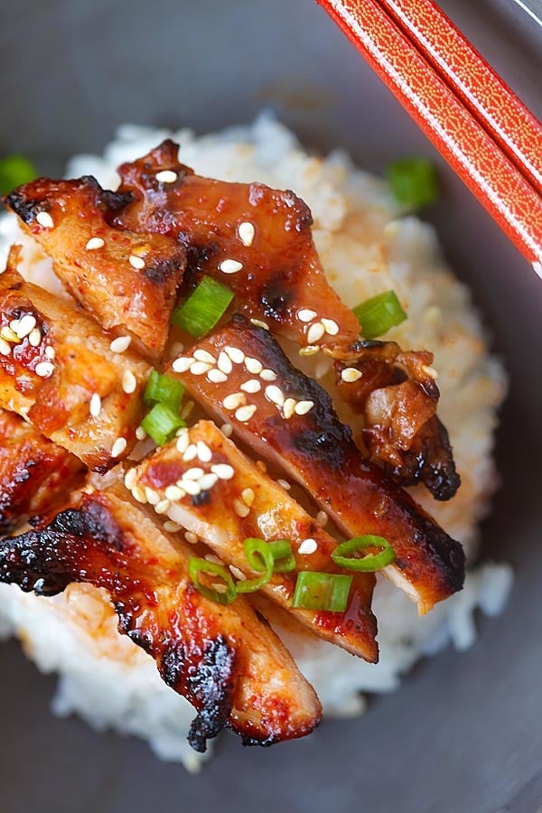 Authentic spicy Korean chicken topped on white rice.