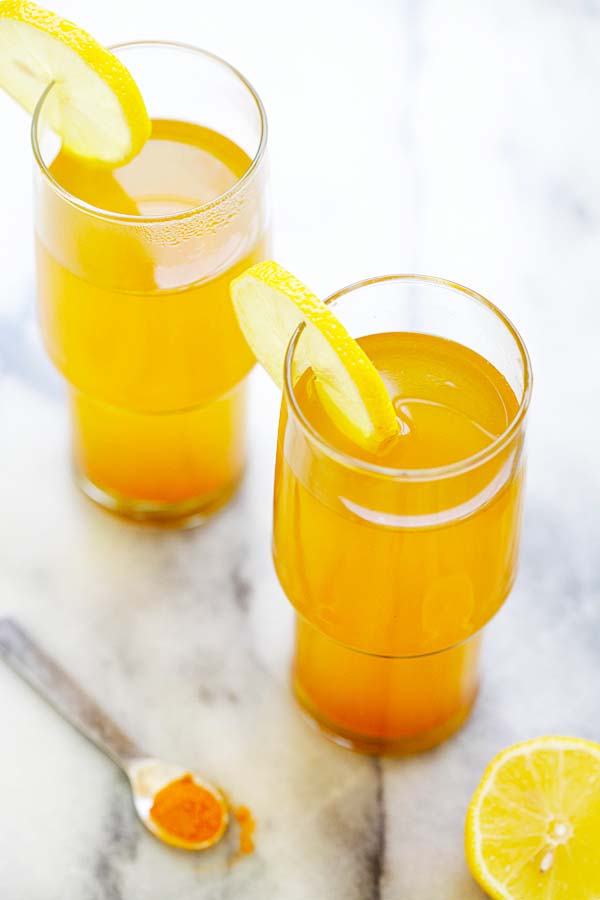 Easy and quick healthy detox tea made with turmeric, apple cider vinegar and honey served in glasses.
