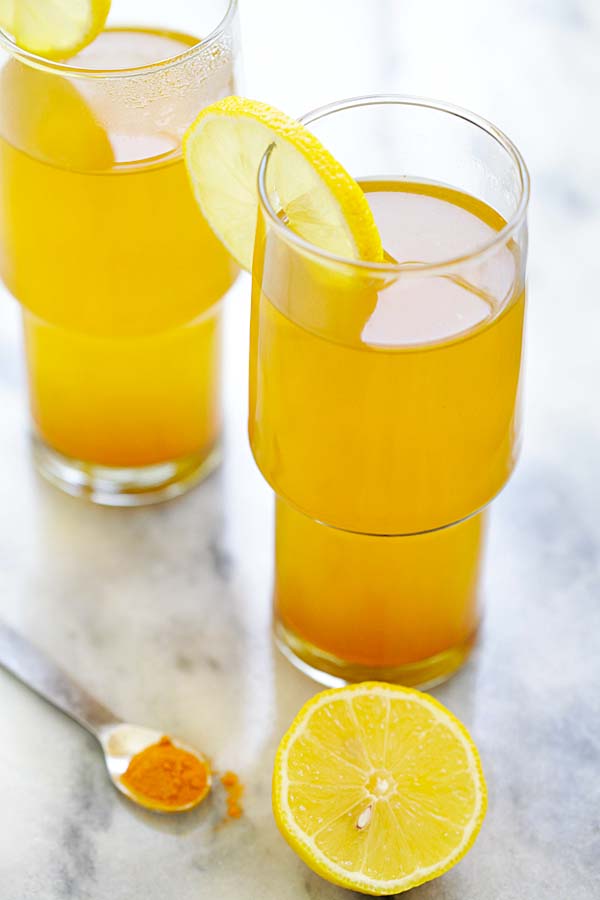 healthy benifits detox tea made with turmeric, apple cider vinegar and honey served in glasses ready to serve.